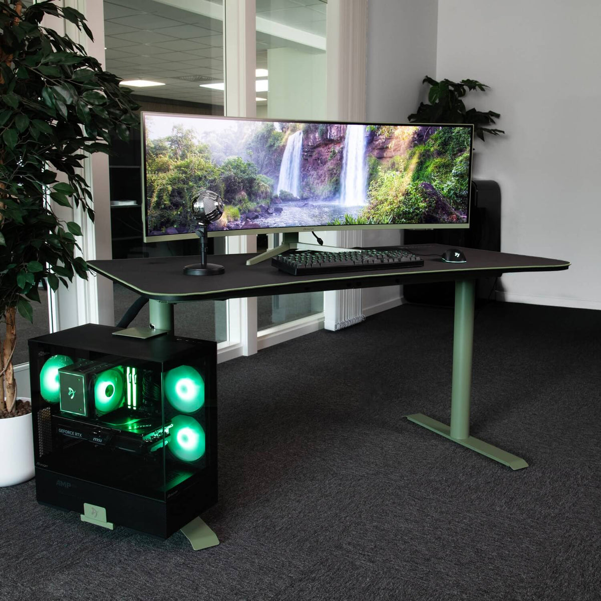 Curved monitor on Arena Gaming Desk by Arozzi Europe, PC with green lights, keyboard, mic in office.