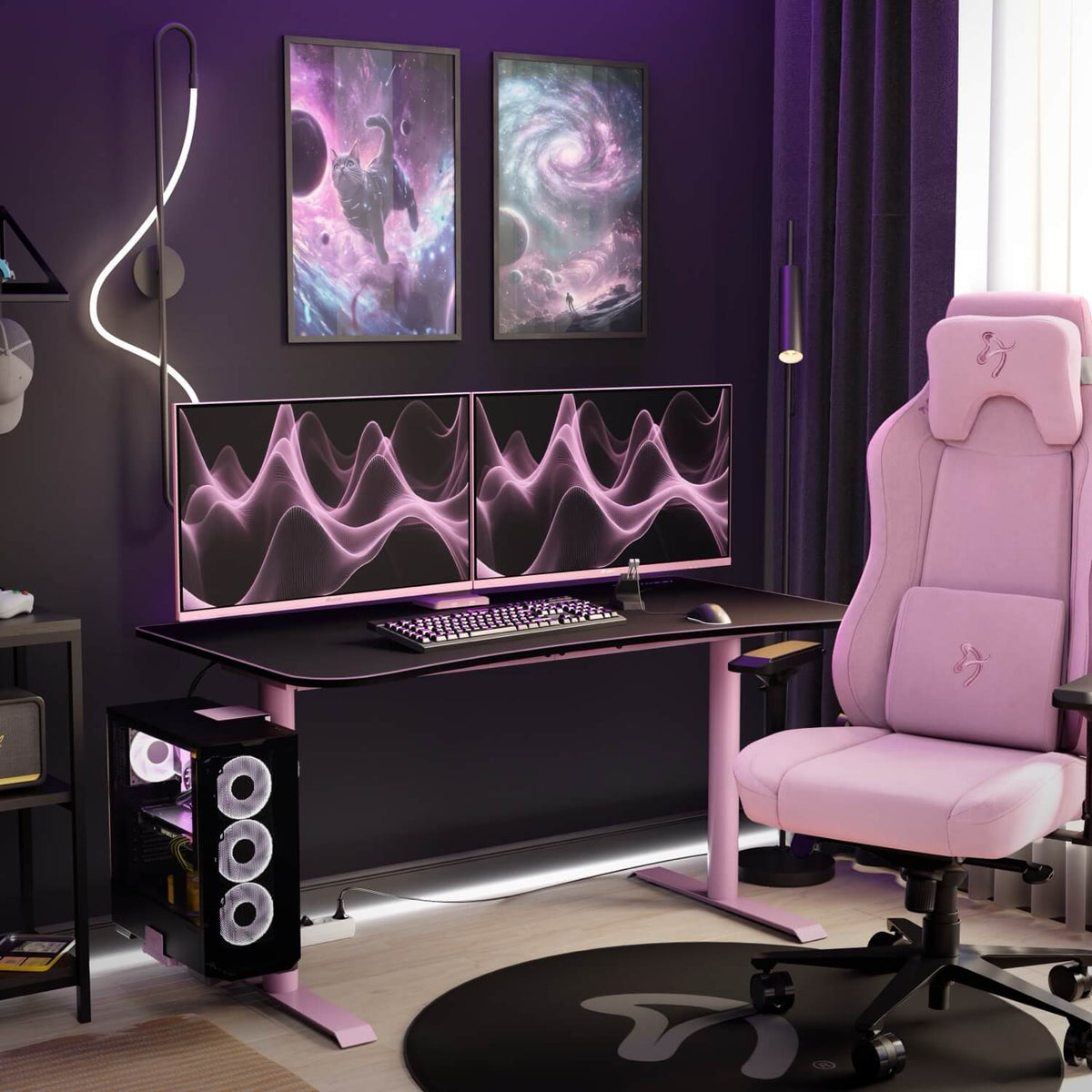 Pink gaming setup with Arena Gaming Desk - Medium, dual monitors, and space-themed wall art.