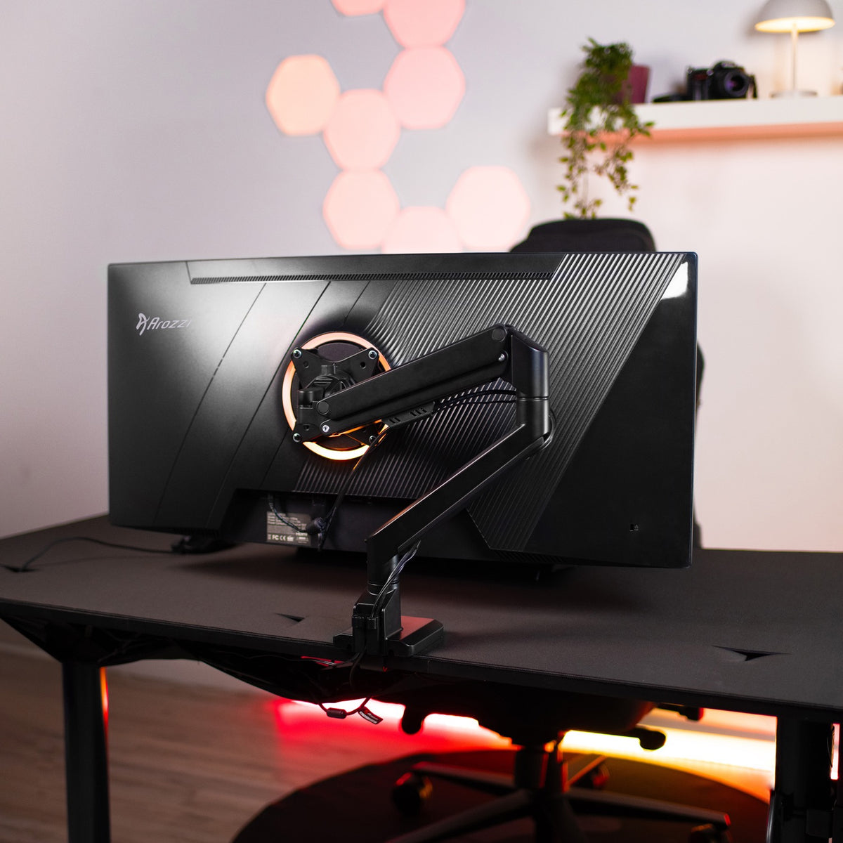 Curved monitor with Arozzi Europe Alzare Neo Single arm in a sleek, color-matched setup.