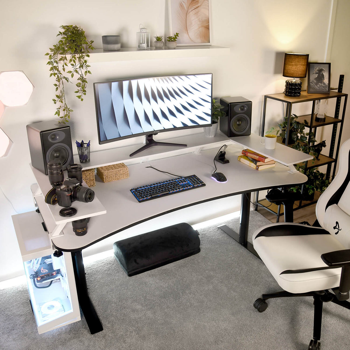 Ergonomic Arozzi Europe desk with Desk Riser - Large, speakers, and gaming chair setup.