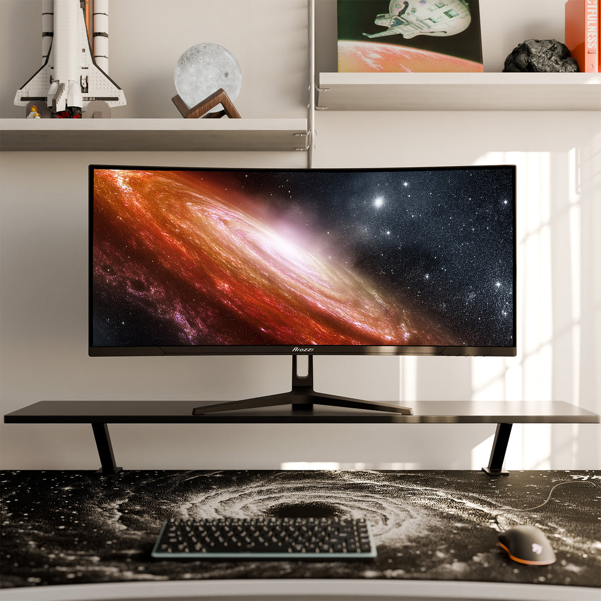 Arozzi Europe Nova 34″ Curved VA 165Hz Gaming Monitor on desk with space-themed decor nearby.
